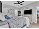 Bedroom with a large bed, and large clock, with decor at 8611 London Park Ct, Raleigh, NC 27615