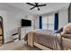 Carpeted bedroom featuring a large bed, and a ceiling fan at 8611 London Park Ct, Raleigh, NC 27615