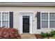 Exterior showing the front door and landscaping at 8611 London Park Ct, Raleigh, NC 27615