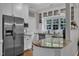 Bright kitchen features stainless steel appliances, granite countertops, and ample cabinet space at 8611 London Park Ct, Raleigh, NC 27615