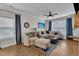 Bright and airy living room with comfortable seating, neutral decor, and hardwood flooring at 8611 London Park Ct, Raleigh, NC 27615