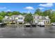 A full view of the parking lot for the townhome community, with mature trees at 8611 London Park Ct, Raleigh, NC 27615