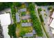 Aerial view of complex showing the buildings with parking lots and surrounding trees, streets at 1002 Willow Drive Dr # 37, Chapel Hill, NC 27514