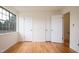 Bright, airy bedroom with hardwood floors, large window, and two closets at 1002 Willow Drive Dr # 37, Chapel Hill, NC 27514