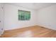Bedroom with hardwood floors, large window, and natural light at 1002 Willow Drive Dr # 37, Chapel Hill, NC 27514