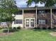 Charming brick townhome with a well-maintained lawn and inviting front entrance at 1002 Willow Drive Dr # 37, Chapel Hill, NC 27514