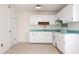 Cozy kitchen featuring white cabinets, stainless steel appliances, and light counter tops at 1002 Willow Drive Dr # 37, Chapel Hill, NC 27514