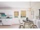 Charming kitchen with white cabinets, teal countertops, and adjacent dining area at 1002 Willow Drive Dr # 37, Chapel Hill, NC 27514