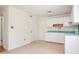 Bright kitchen featuring white cabinets, stainless steel appliances, and light counter tops at 1002 Willow Drive Dr # 37, Chapel Hill, NC 27514