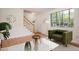 Cozy living room features a parquet floor, a staircase, and large window with natural light at 1002 Willow Drive Dr # 37, Chapel Hill, NC 27514