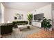 Tastefully decorated living room with stylish furniture and a large TV at 1002 Willow Drive Dr # 37, Chapel Hill, NC 27514