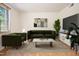 Tastefully decorated living room with stylish furniture and a large TV at 1002 Willow Drive Dr # 37, Chapel Hill, NC 27514