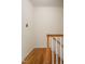 Hardwood staircase with white railing at 1002 Willow Drive Dr # 37, Chapel Hill, NC 27514