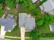 Aerial view of the home showcasing the backyard deck and mature trees at 1004 Manderston Ln, Apex, NC 27502