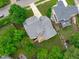 Aerial view of the property featuring the backyard deck and mature trees at 1004 Manderston Ln, Apex, NC 27502