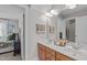 Bathroom with a double sink vanity, and a large mirror at 1004 Manderston Ln, Apex, NC 27502