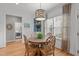 This dining area has a round table, detailed chairs and a large window at 1004 Manderston Ln, Apex, NC 27502