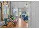 View from doorway into a sun-filled living room, featuring a fireplace and view to the breakfast bar at 1004 Manderston Ln, Apex, NC 27502