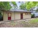 Back view of building with two entrances and well manicured lawn and landscaping at 1008 Dorothea Dr, Raleigh, NC 27603