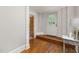 A foyer showcasing hardwood flooring and a white door leading outside at 1008 Dorothea Dr, Raleigh, NC 27603