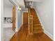The foyer has a staircase, hardwood floors, and a view to an adjoining room at 1008 Dorothea Dr, Raleigh, NC 27603