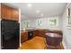 Bright kitchen with stainless steel appliances, granite counters, and a cozy breakfast nook at 1008 Dorothea Dr, Raleigh, NC 27603