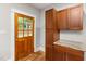 Kitchen detail showing door, cabinets, countertop, and a 'hello' welcome mat at 1008 Dorothea Dr, Raleigh, NC 27603
