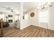 Bright living room with fireplace, wood flooring, elegant chandeliers and abundant natural light at 102 Michelangelo Pl, Morrisville, NC 27560