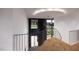 Modern staircase with unique railing and herringbone flooring at 1021 Ferson, Apex, NC 27519