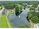 Aerial view of a pond with fountain and community amenities at 103 Lake Tillery Dr, Cary, NC 27519