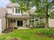 Backyard with patio, green lawn, and landscaped garden at 103 Lake Tillery Dr, Cary, NC 27519