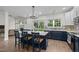 Spacious kitchen with an island, modern lighting, and sleek appliances at 103 Lake Tillery Dr, Cary, NC 27519
