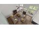 Aerial view of a living room featuring large windows and a fireplace at 103 Lake Tillery Dr, Cary, NC 27519