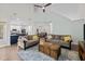 Open-concept living room showcasing hardwood floors and seamless flow into the kitchen and dining areas at 103 Lake Tillery Dr, Cary, NC 27519