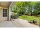 Outdoor patio with two chairs, a small table, and potted plants at 103 Lake Tillery Dr, Cary, NC 27519