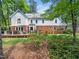 Expansive backyard featuring a well-maintained lawn and a spacious deck for outdoor living at 103 Lochwood West Dr, Cary, NC 27518