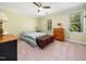 Charming bedroom with a ceiling fan, wood chest, and natural light from the window at 103 Lochwood West Dr, Cary, NC 27518