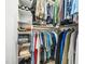 Walk-in closet featuring custom shelving, shoe racks, and hanging space for clothing at 103 Lochwood West Dr, Cary, NC 27518