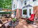 Inviting deck with outdoor seating, perfect for enjoying the peaceful backyard at 103 Lochwood West Dr, Cary, NC 27518