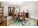 Elegant dining room with hardwood floors, a china cabinet, and a chandelier at 103 Lochwood West Dr, Cary, NC 27518