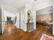Spacious home foyer with wood flooring, elegant furnishings, and classic design at 103 Lochwood West Dr, Cary, NC 27518