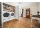Bonus room and laundry area featuring a washer, dryer, and built-in shelving at 103 Lochwood West Dr, Cary, NC 27518