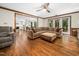Spacious living room with hardwood floors connecting to kitchen and dining areas at 103 Lochwood West Dr, Cary, NC 27518