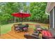 Back deck with outdoor seating and umbrella at 103 Rose Sky Ct, Cary, NC 27513