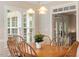 Charming breakfast nook featuring a wooden table set, large windows and detailed trim work at 103 Rose Sky Ct, Cary, NC 27513