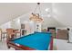 Spacious game room with pool table, kitchenette, and comfortable seating at 103 Rose Sky Ct, Cary, NC 27513