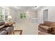 Spacious living room with furniture, bookshelf and ample natural light at 103 Rose Sky Ct, Cary, NC 27513