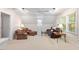 Cozy living room with plush seating, ceiling fan and natural light at 103 Rose Sky Ct, Cary, NC 27513