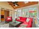 Casual sunroom area with vaulted ceilings, outdoor seating, and bright natural light at 103 Rose Sky Ct, Cary, NC 27513