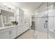 This elegant bathroom boasts double sinks, custom cabinets, and a glass-enclosed shower at 10529 Sablewood Dr # 111, Raleigh, NC 27617